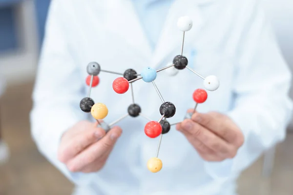 Scientist with molecular model — Stock Photo