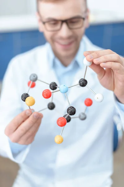 Scientist with molecular model — Stock Photo