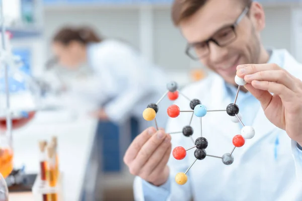 Scientist with molecular model — Stock Photo