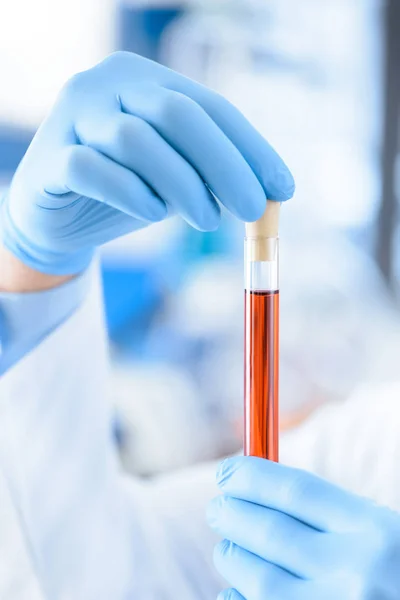 Scientist with test tube — Stock Photo