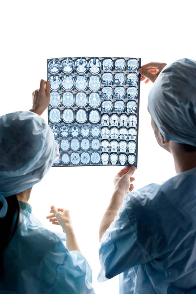 Surgeons examining x-ray image — Stock Photo