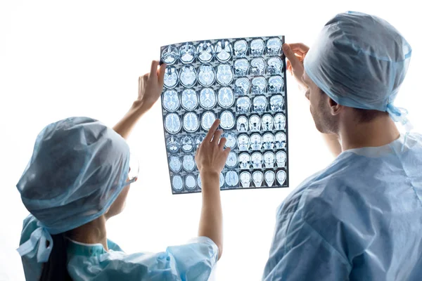 Surgeons examining x-ray image — Stock Photo