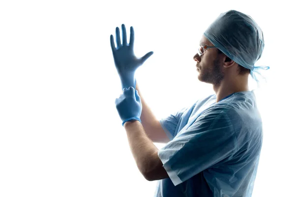 Surgeon wearing gloves — Stock Photo