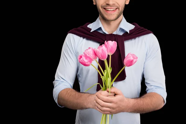 Homem segurando tulipas — Fotografia de Stock