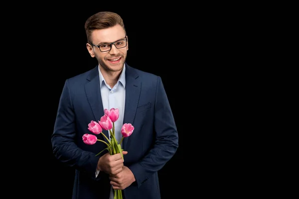 Uomo che tiene i tulipani — Foto stock
