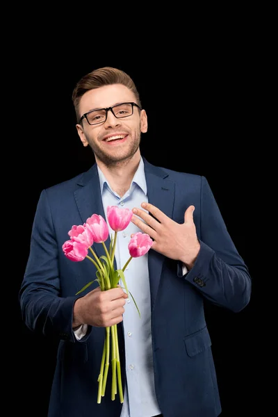 Homem segurando tulipas — Fotografia de Stock