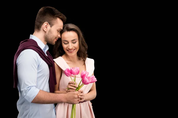 Couple in love with tulips — Stock Photo