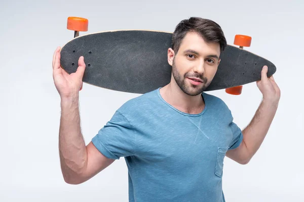 Young man with skateboard — Stock Photo