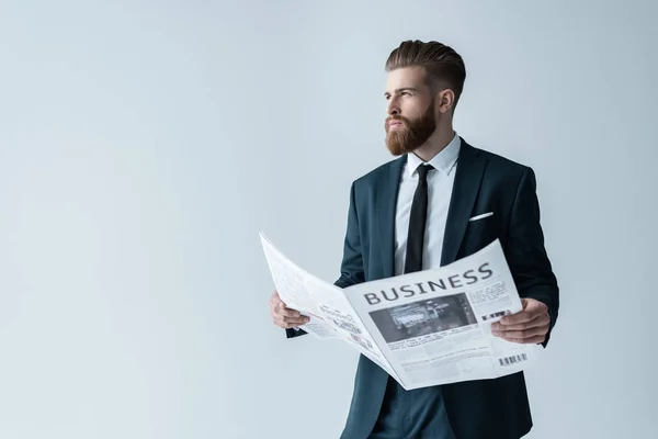 Businessman reading newspaper — Stock Photo