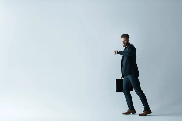 Handsome businessman with briefcase — Stock Photo