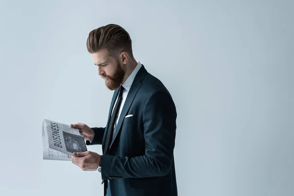 Businessman reading newspaper — Stock Photo