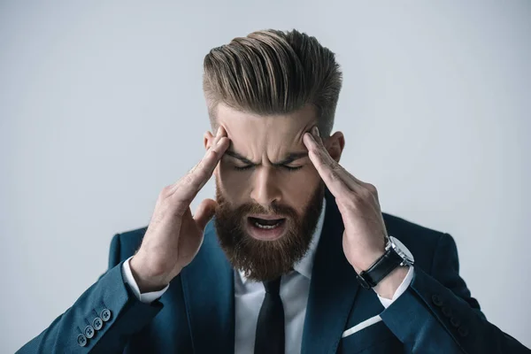 Young businessman with headache — Stock Photo