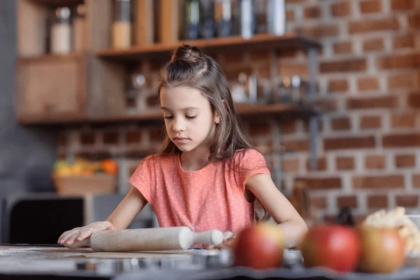 Girl kneading dough — Stock Photo