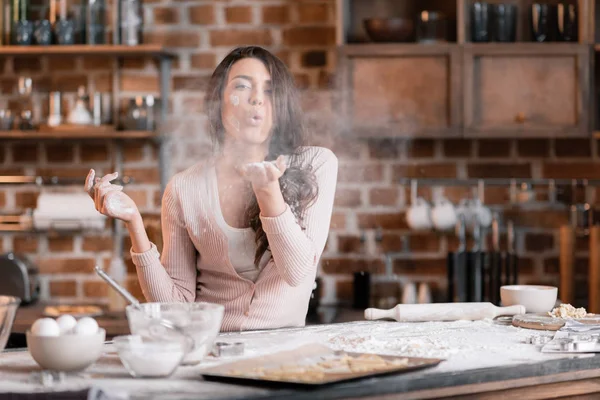 Young woman in flour — Stock Photo