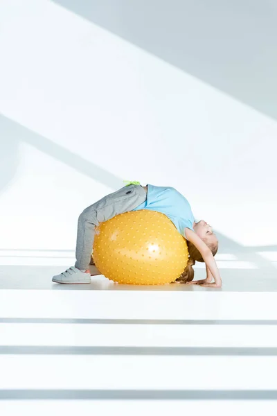Girl exercising on fitness ball — Stock Photo