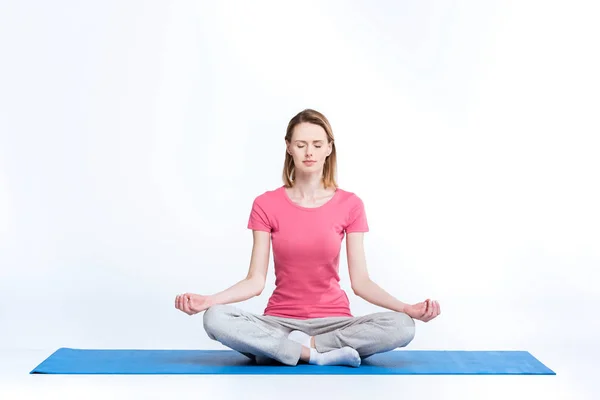Woman practicing yoga — Stock Photo
