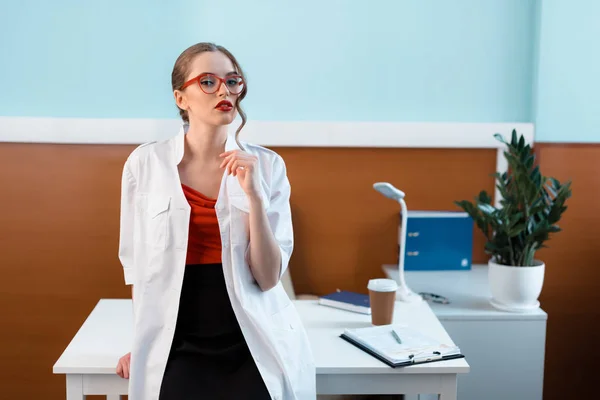 Young doctor in cabinet — Stock Photo