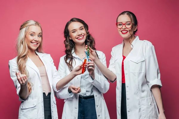 Scientists clinking with test tubes — Stock Photo