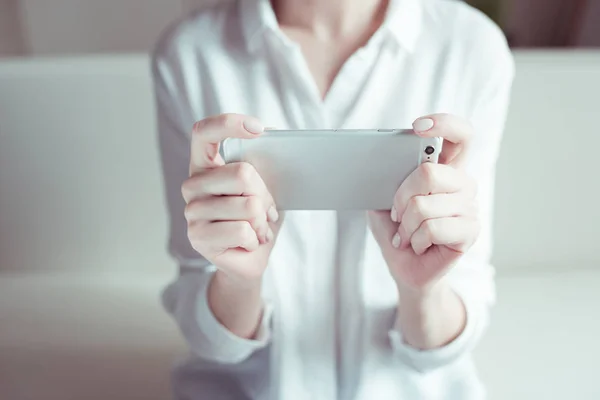 Woman holding smartphone — Stock Photo