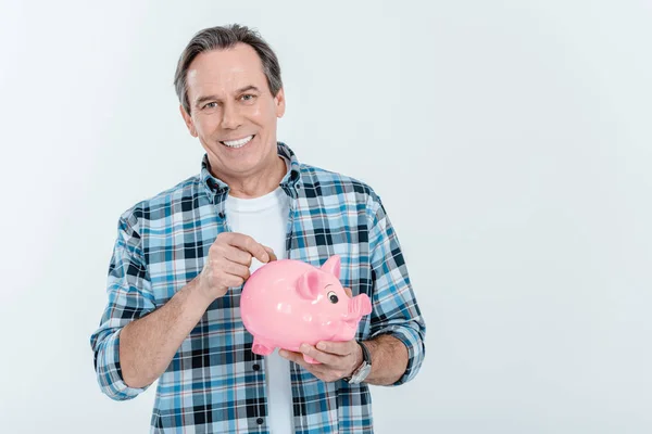 Homem segurando Piggy Bank — Fotografia de Stock