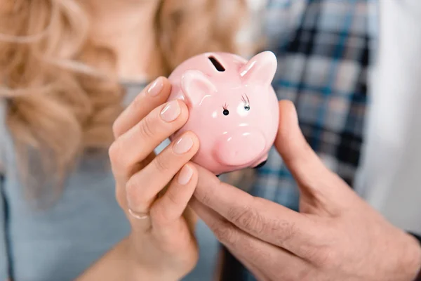 Couple holding piggy bank — Stock Photo