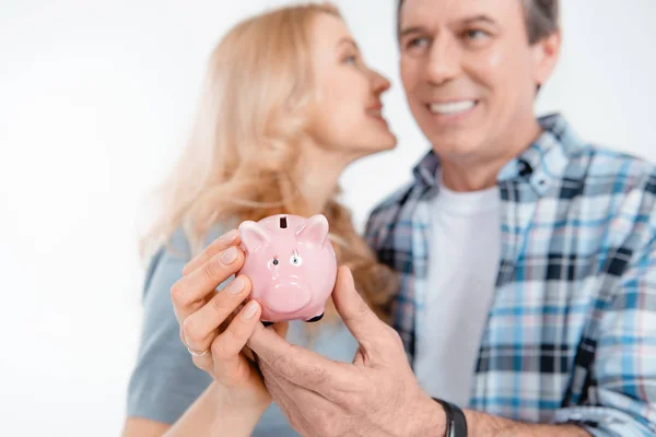 Couple holding piggy bank — Stock Photo