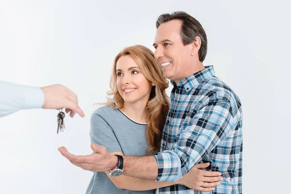 Couple receiving keys from house — Stock Photo