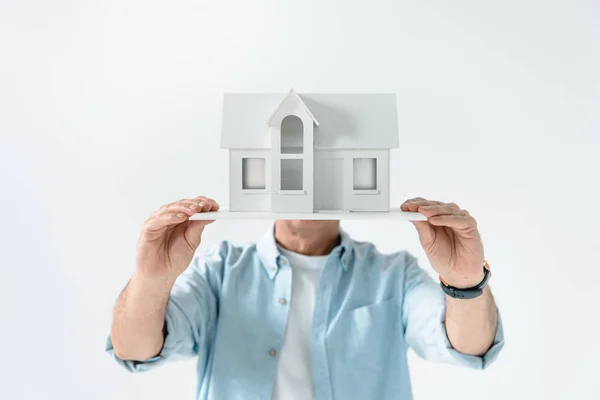 Man with house model — Stock Photo