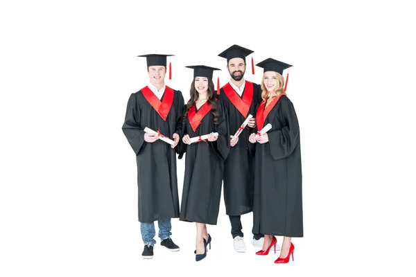 Happy students with diplomas — Stock Photo