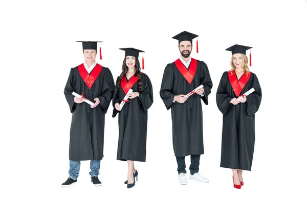 Estudiantes felices con diplomas — Stock Photo