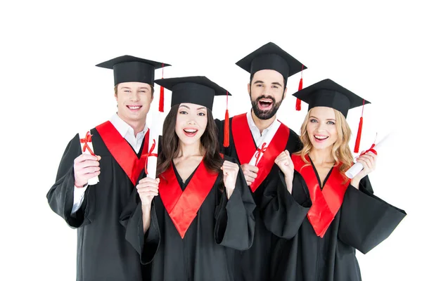 Studenti felici con diplomi — Foto stock