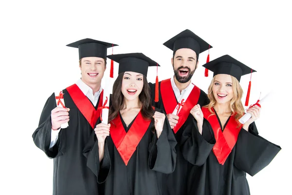 Happy students with diplomas — Stock Photo