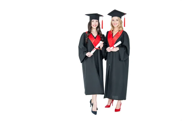 Happy students with diplomas — Stock Photo