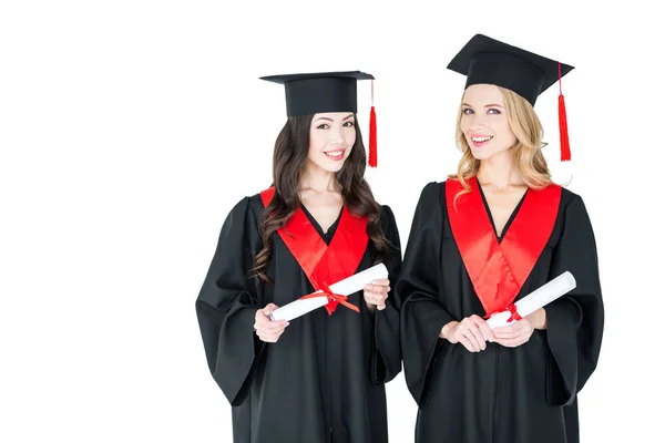 Estudiantes felices con diplomas - foto de stock