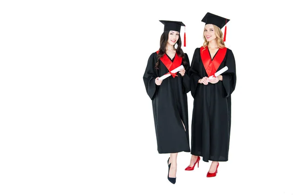 Happy students with diplomas — Stock Photo