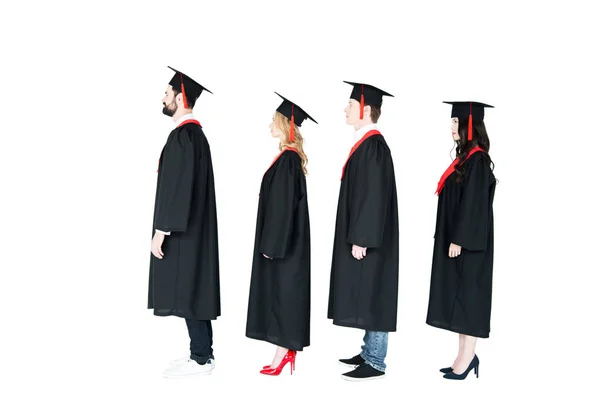 Happy students in mortarboards — Stock Photo