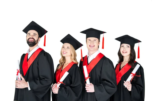 Happy students with diplomas — Stock Photo