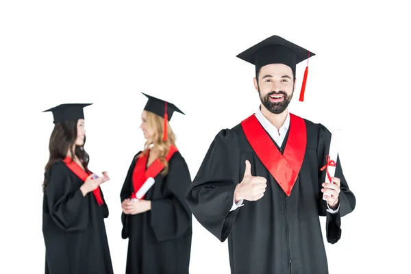 Happy students with diplomas — Stock Photo