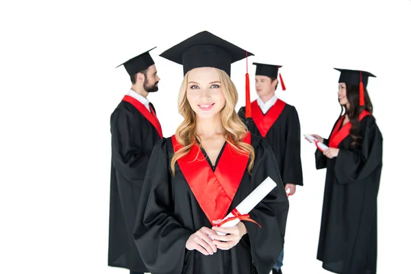 Happy students with diplomas — Stock Photo