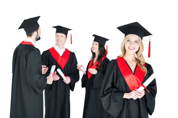 Happy students with diplomas — Stock Photo