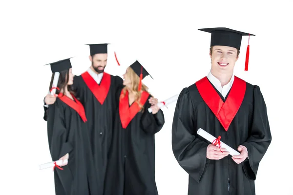 Happy students with diplomas — Stock Photo