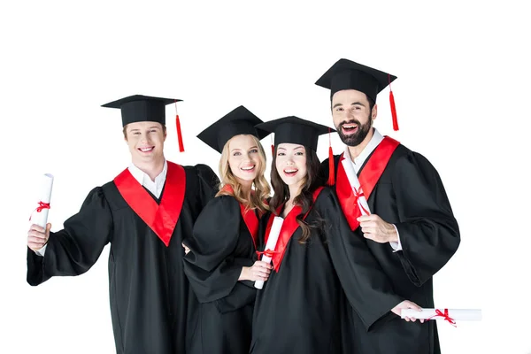 Studenti felici con diplomi — Foto stock