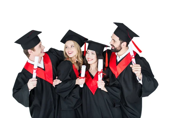 Happy students with diplomas — Stock Photo