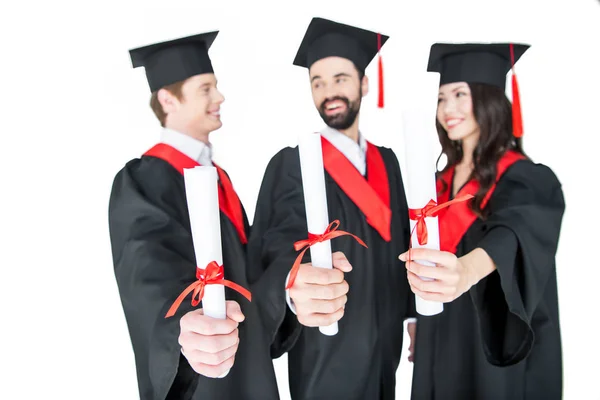 Happy students with diplomas — Stock Photo