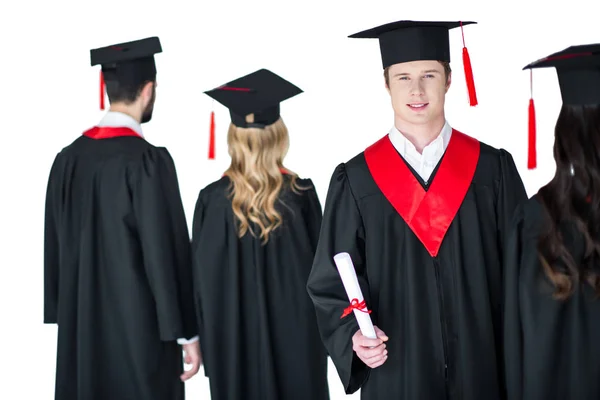 Étudiant en chapeau de graduation avec diplôme — Photo de stock