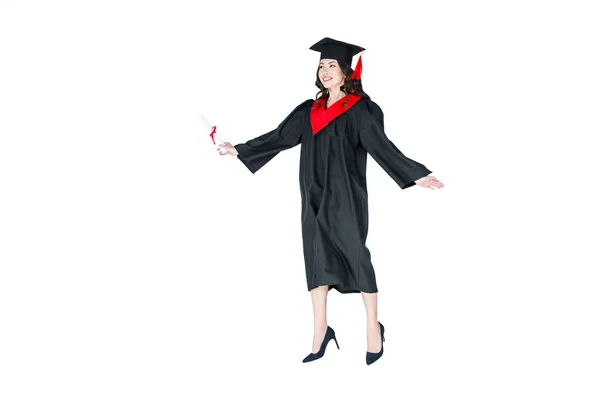 Estudiante en gorra de graduación con diploma - foto de stock