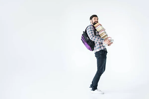 Étudiant avec pile de livres — Photo de stock