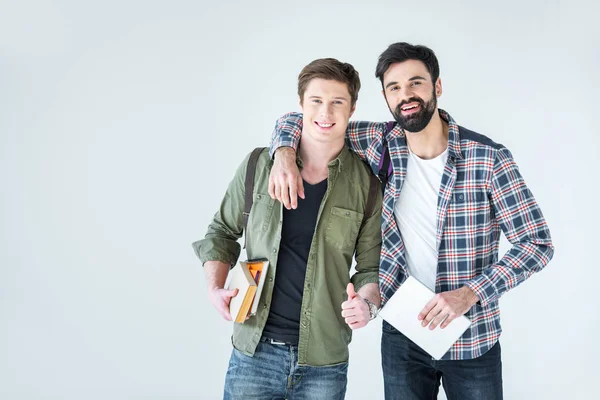 Estudiantes sosteniendo libros - foto de stock