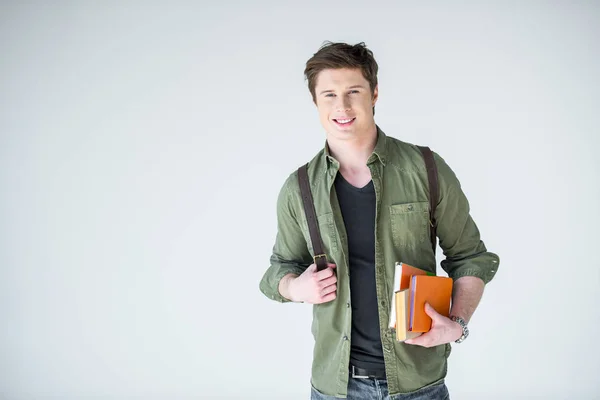 Student holding books — Stock Photo