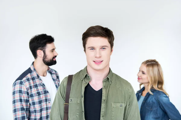 Young man with friend behind — Stock Photo